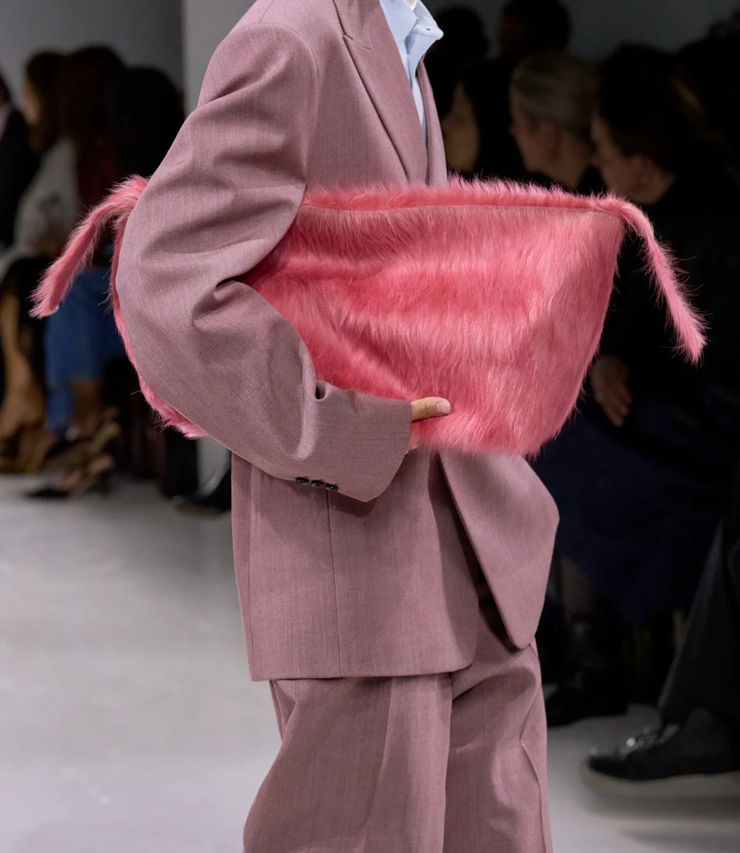 Precise, sculptural silhouettes are matched by bountiful textures – tasselled, flouncing, fluffy. Summer-weight fabrics meet carefully constructed interiors, each shaped with the discipline and rigour of traditional men’s tailoring. Iconic bags are reimagined in new expressions and proportions, while fresh arrivals include the huggable Squash bag, a tasselled evening clutch, and a framed tote